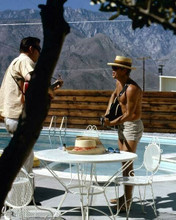 Steve McQueen bare chested playing guitar in back yard by pool 8x10 inch photo