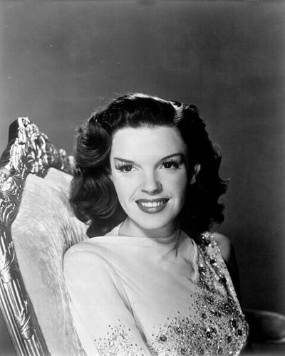 Judy Garland smiling 1940's studio portrait seated on chair 8x10 inch ...