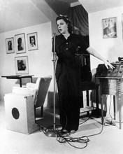 Judy Garland full length pose singing into microphone 8x10 inch photo