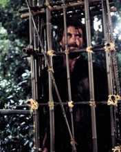 Tom Selleck trapped in cage in scene from Magnum P.I. 8x10 inch photo