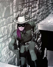 The Lone Ranger Clayton Moore on stairs guns at ready 8x10 inch photo