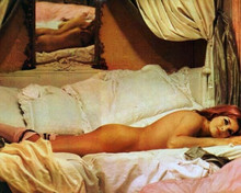 Senta Berger lies on bed wearing stockings 8x10 inch photo