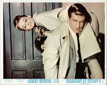 Breakfast at Tiffany's George Peppard carries Audrey Hepburn over his shoulder