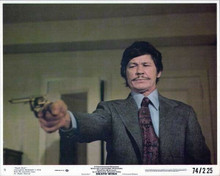 Death Wish 1974 Charles Bronson as Paul Kersey aims gun 8x10 inch photo