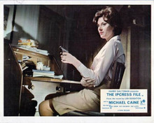 The Ipcress File 8x10 inch photo Sue Lloyd sat at desk pointing gun
