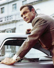 Sean Connery as James Bond leaning on Aston Martin from Goldfinger 8x10 photo