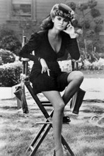 Raquel Welch in short black dress sitting on studio chair 4x6 inch real photo