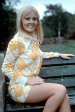 Yutte Stensgaard 1970 smiling in mini skirt sat on bench Hammer star 8x12 photo