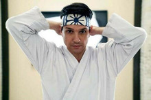 Ralph Macchio as Daniel La Russo puts on classic head scarf Cobra Kai 8x12 photo