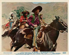 The Magnificent Seven Eli Wallach on horseback riding with men 8x10 inch photo
