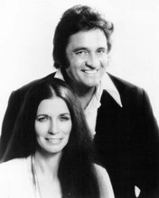 Johnny Cash poses for a portrait with june Carter Cash 1970's11x17 inch Poster