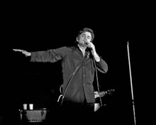Johnny Cash wearing black shirt on stage in concert circa 1970's 11x17 Poster