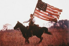 Mel Gibson 11x17 Mini Poster The Patriot with ragged American Flag on horse