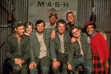 M.A.S.H TV series Alan Alda & cast line-up seated on bench by MASH sign 11x17