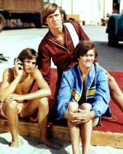 The Monkees classic 1960's pose sitting on beach 16x20 Poster