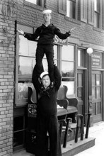 Laurel and Hardy Stan balances on Ollie's shoulders 12x18 Poster