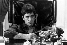 Al Pacino as Scarface sits menacingly in chair holding cigar 12x18 Poster