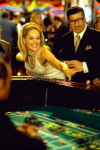 Sharon Stone in full swing betting throwing dice in Casino 12x18 inch Poster