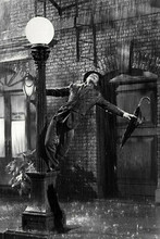 Singin' in The Rain classic dance scene Gene swings on lamp post 8x10 inch photo