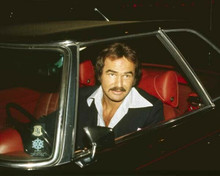 Burt Reynolds candid at the wheel of his car early 1970's smiling 8x10 photo