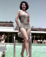 Linda Cristal smiling poses on steps by pool in swimsuit 1960's 8x10 inch photo