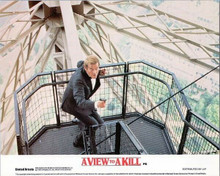 A View To A Kill Roger Moore in tuxedo with gun on Eiffel Tower 8x10 inch photo