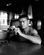 Chuck Connors 1950's peeling potatoes in unidentified movie 8x10 inch photo