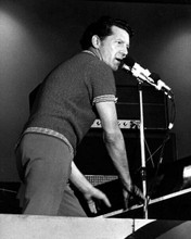 Jerry Lee Lewis on stage 1970's standing playing piano & singing 8x10 inch photo