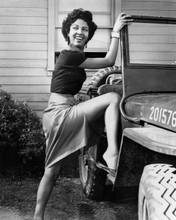 Dorothy Dandridge shows some leg as she gets in Jeep 8x10 inch photo