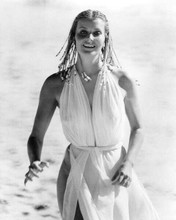 Bo Derek with braids in white dress running on beach 10 8x10 inch photo