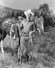 Gene Autry poses in field with his horse 8x10 inch photo
