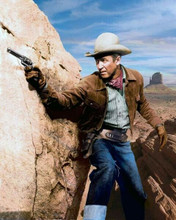 James Stewart in iconic western pose gun drawn wearing jeans & jacket 8x10 photo