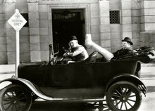Laurel and Hardy County Hospital Stan drives car Ollie in back with leg in air