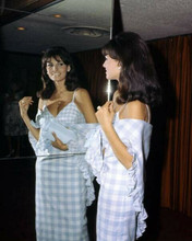 Raquel Welch circa 1966 incheckered dress showing cleavage looks in mirror 8x10