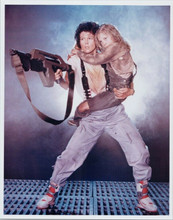 Aliens Sigourney Weaver points rifle holding Carrie Hen full length 8x10 photo