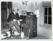 Gene Autry in action aiming his rifle in western movie 8x10 photo