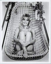Sharon Tate sits in 1960's wicker hanging chair smiling 8x10 photo