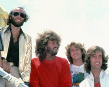 The Bee Gees rare of the four Gibb brothers smiling for cameras 8x10 inch photo