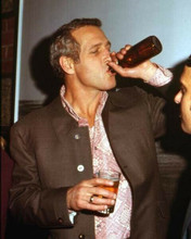 Paul Newman candid circa 1970 swigging from beer bottle 8x10 inch photo