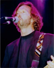 Eric Clapton in concert in black t-shirt & jacket singing 8x10 inch photo