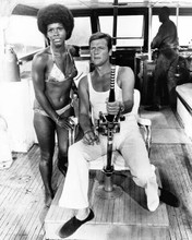 Live and Let Die Roger Moore holds fishing rod on boat Gloria Hendry 8x10 photo