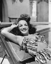 Carmen Miranda lies back in bikini style outfit big smile 8x10 inch photo