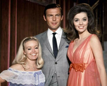 Adam West in suit poses with two unidentified women 1960's 8x10 inch photo