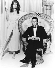 Octopussy 1983 Roger Moore in tuxedo as Bond Maud Adams with gun 8x10 inch photo