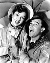 Singin' in The Rain Debbie Reynolds & Gene in raincoats with umbrella 8x10 photo