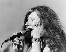 Janis Joplin singing into microphone in concert 8x10 inch photo