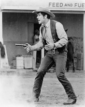 Robert Fuller in gunfight scene in western street movie unknown 8x10 inch photo