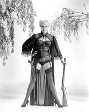 Janet Leigh stnads legs apart in stockings and basque holding rifle 8x10 photo