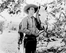 John Wayne 1930's western movie posing with his horse 8x10 inch photo