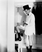 Humphrey Bogart without pants trying on white shirt & top hat 8x10 inch photo
